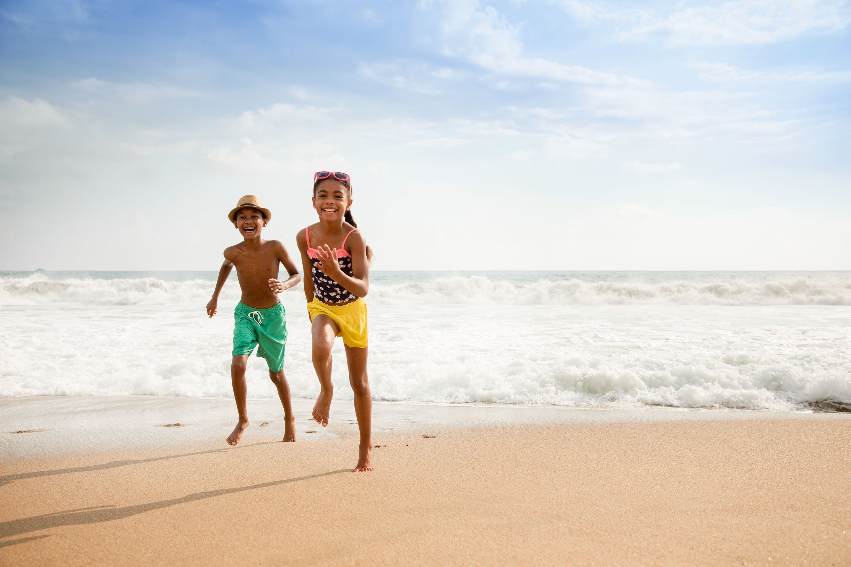 Kids running on the beach